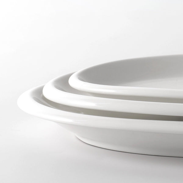 Close-up of a white ceramic bowl on a light gray background