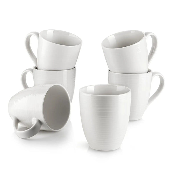 Set of 6 white ceramic mugs on a white background