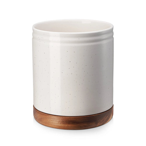 Ceramic rotating utensil holder with wooden base on a white background