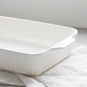 White ceramic baking dish on a light gray background